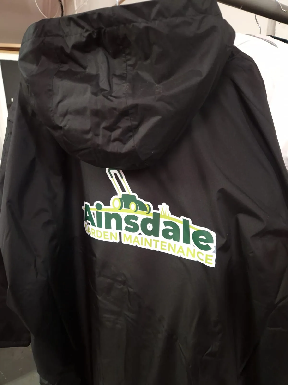 Black hooded jacket with Ainsdale back logo