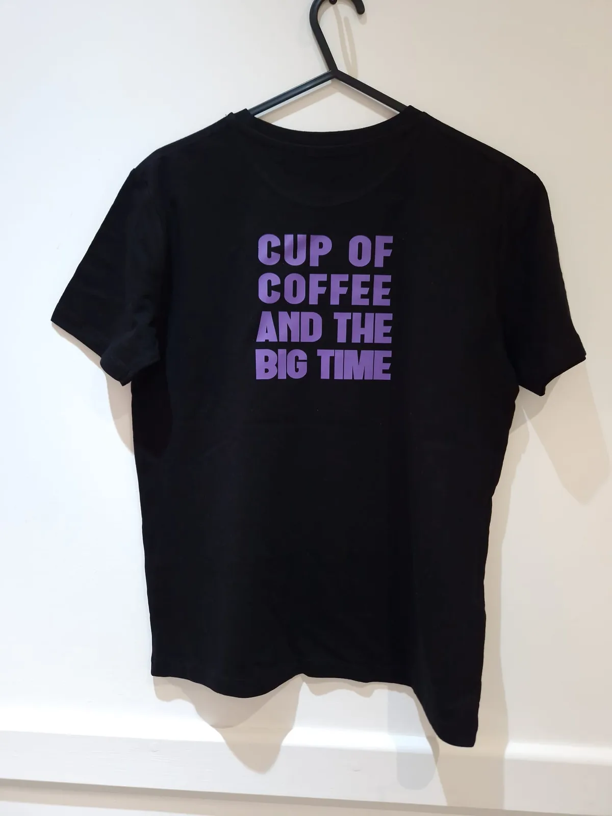 Black t-shirt with purple coffee slogan