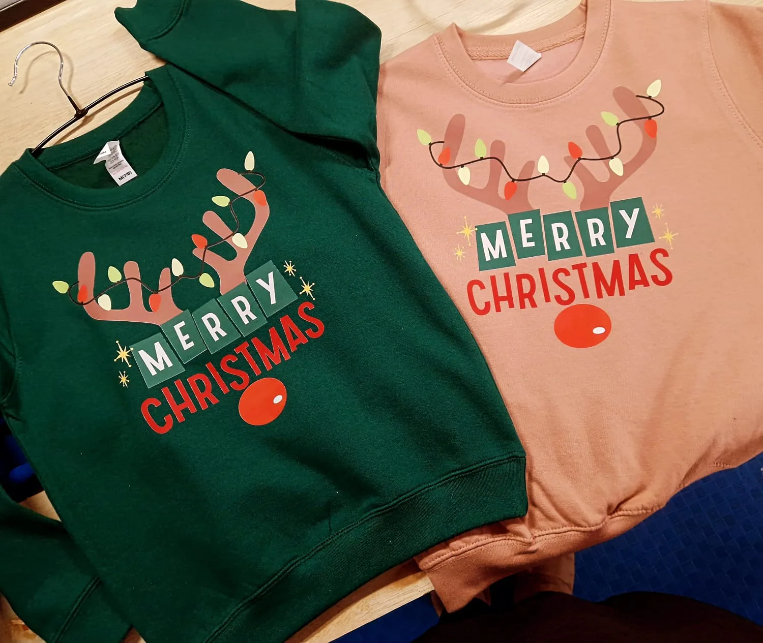Green and pink t-shirts with matching Merry Christmas reindeer designs