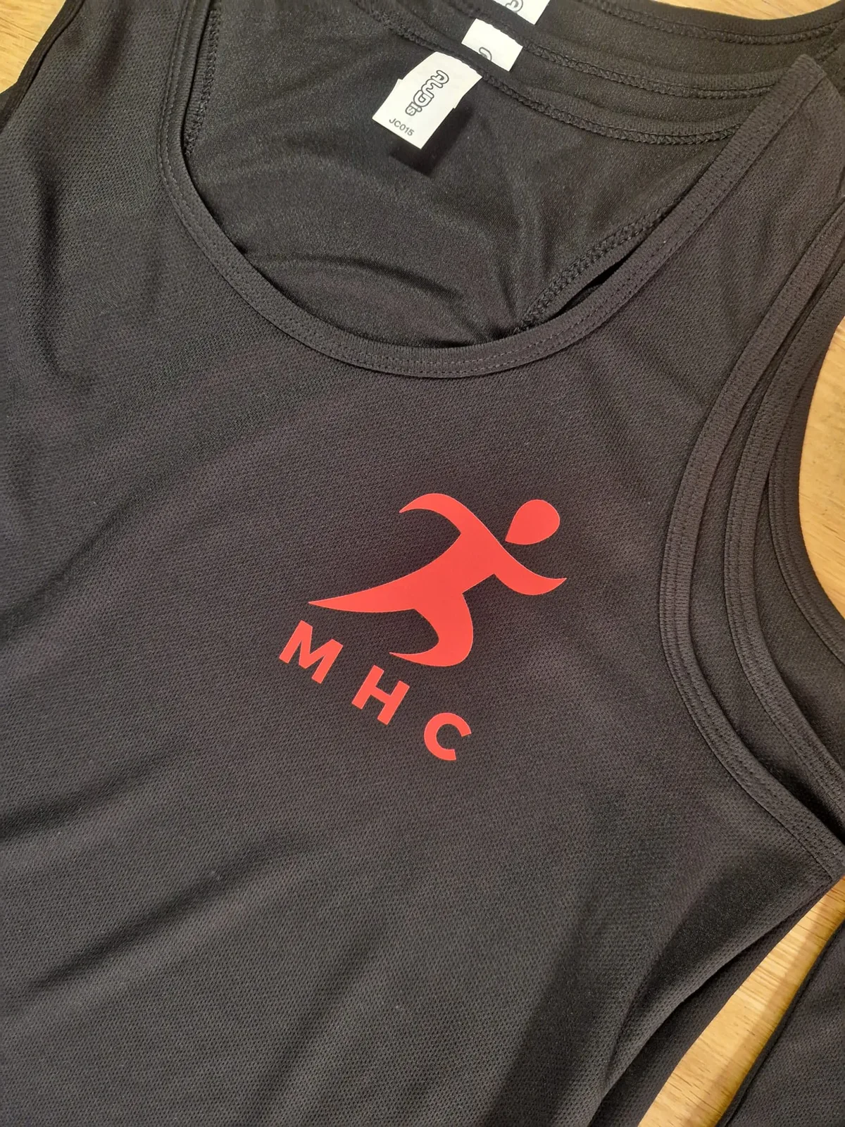 Black training vests with red MHC chest logos