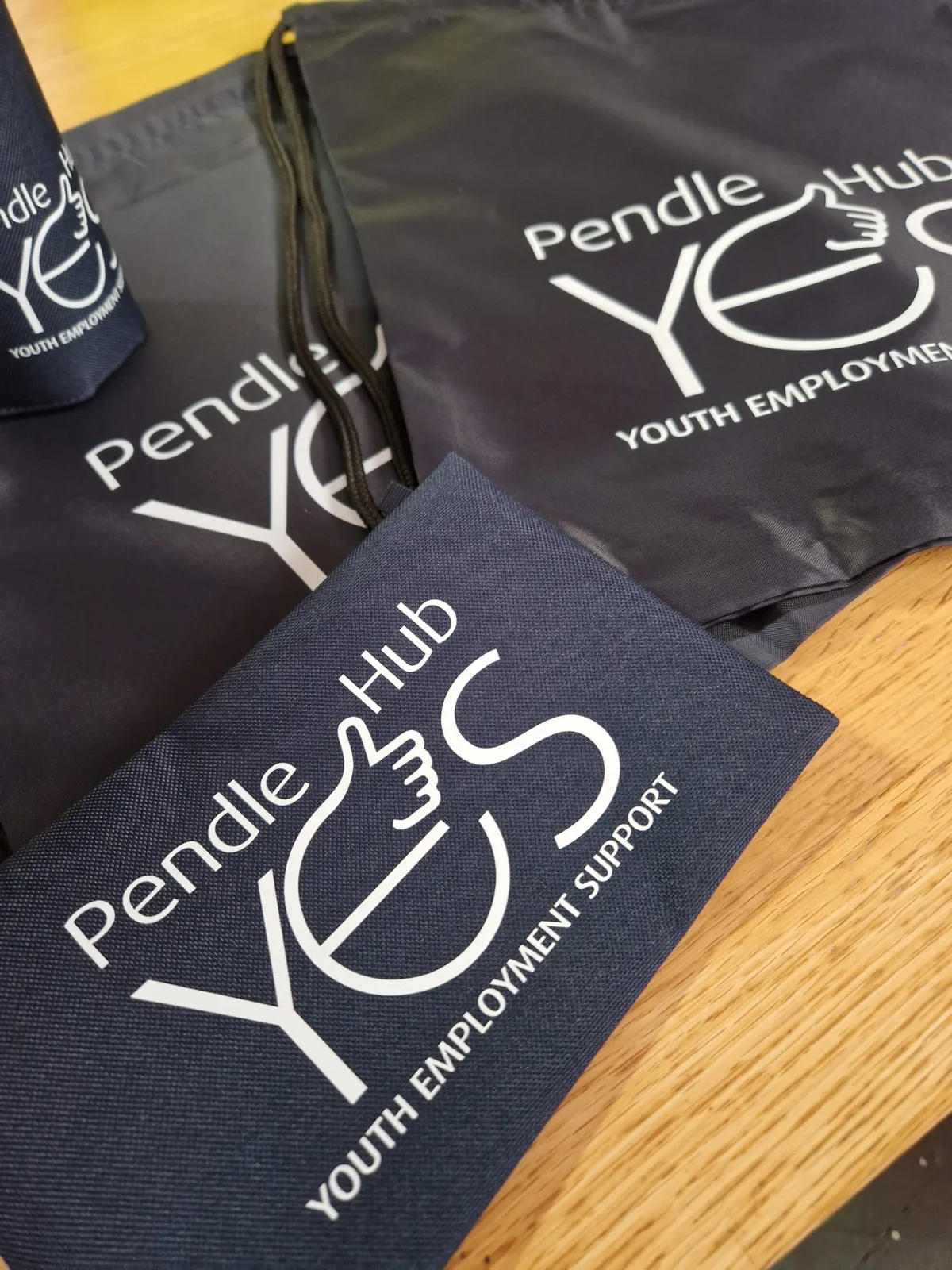 Pendle Hub YES branded drawstring bag, bottle and accessories