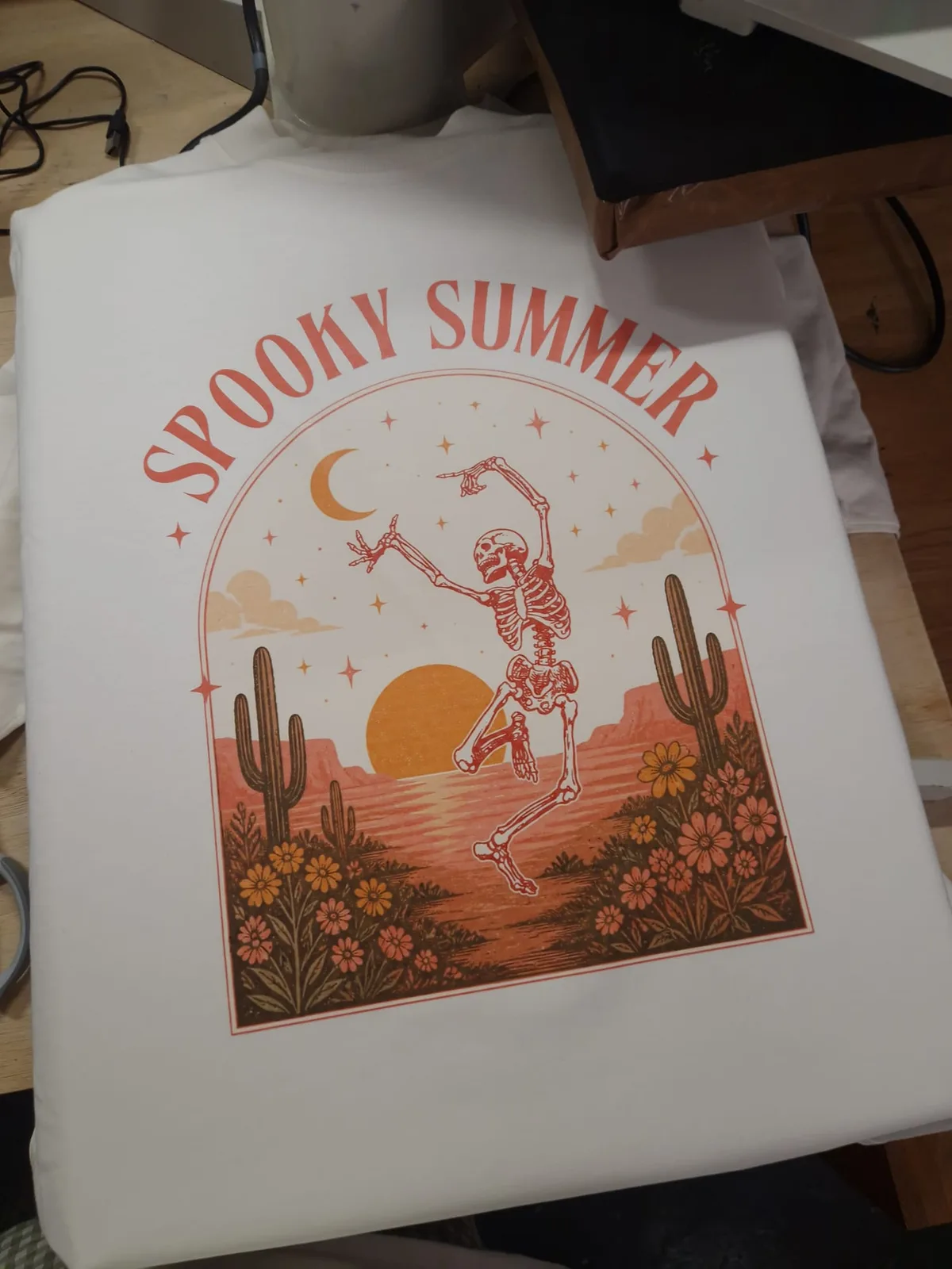 White t-shirt with Spooky Summer skeleton graphic