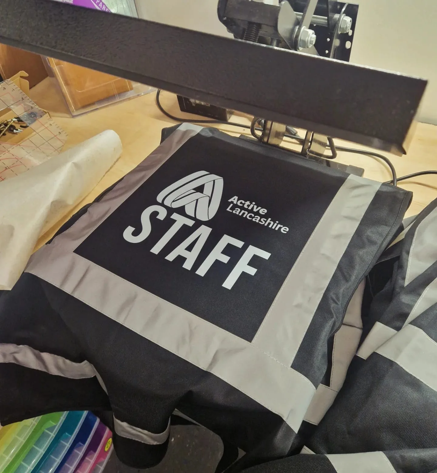 Dark reflective staff vest with Active Lancashire logo and STAFF back print