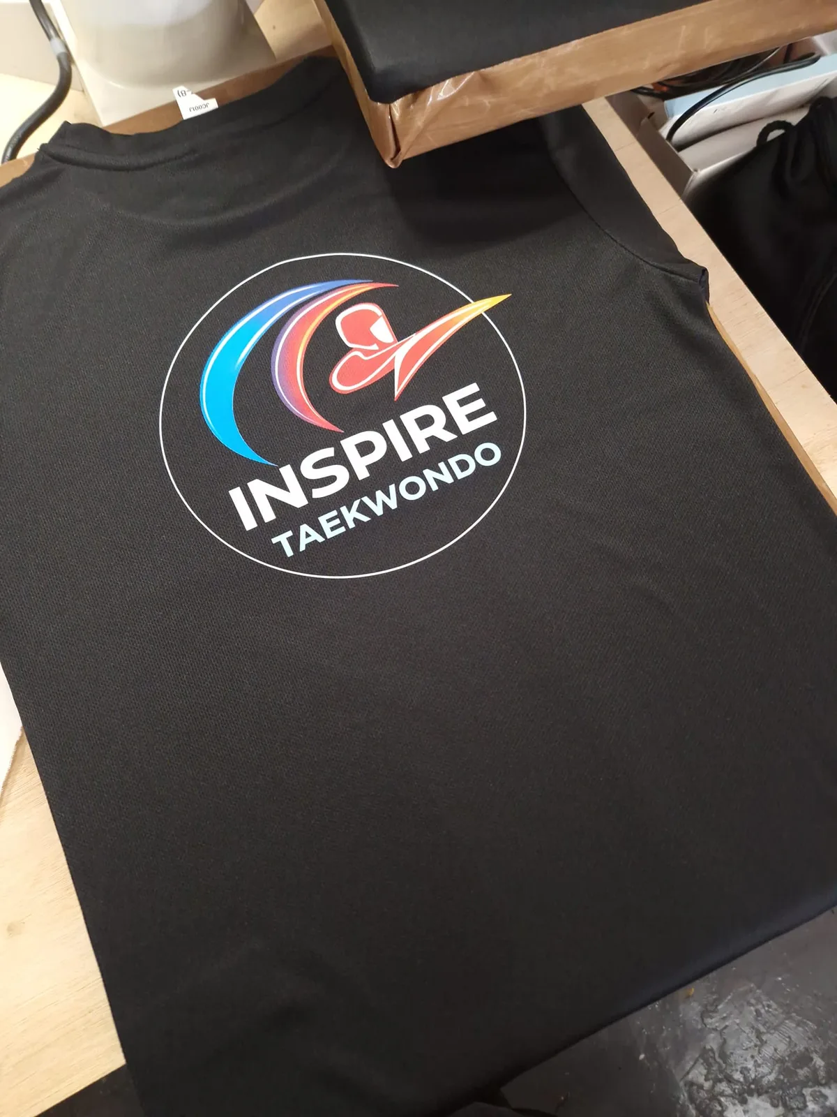 Black t-shirt with full-colour Inspire Taekwondo logo