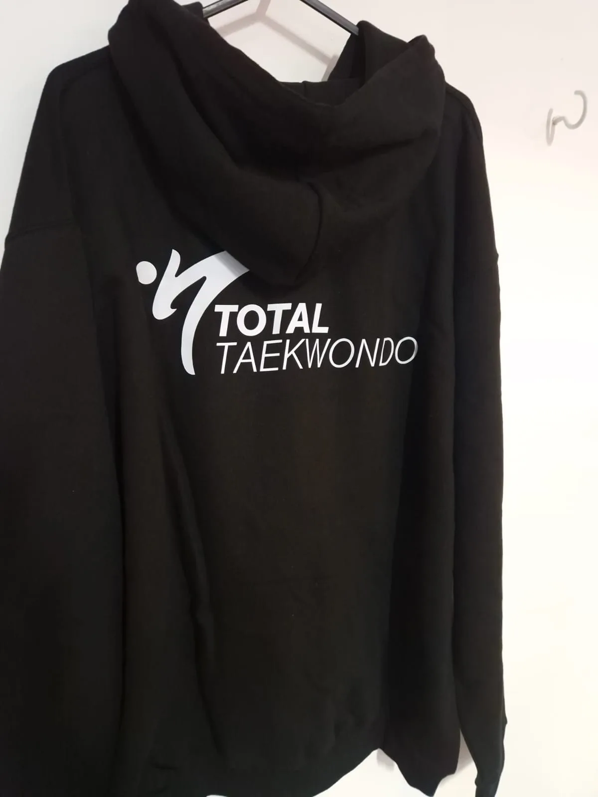 Black hoodie with white Total Taekwondo back logo